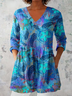 Blue patterned long blouse with V-neck, three-quarter sleeves and gathered hem