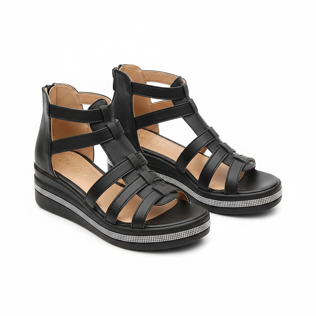 Black strappy wedge sandals with open-toe cutouts, back pull tab, and rhinestone-edged sole
