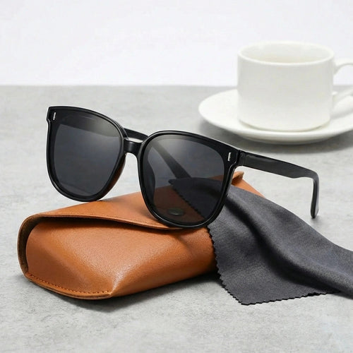 Oversized square sunglasses, glossy black frames with dark tinted lenses, UV400