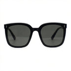 Oversized square sunglasses, glossy black frames with dark tinted lenses