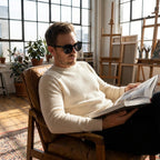 Oversized square sunglasses on a person, glossy black frames with dark tinted lenses