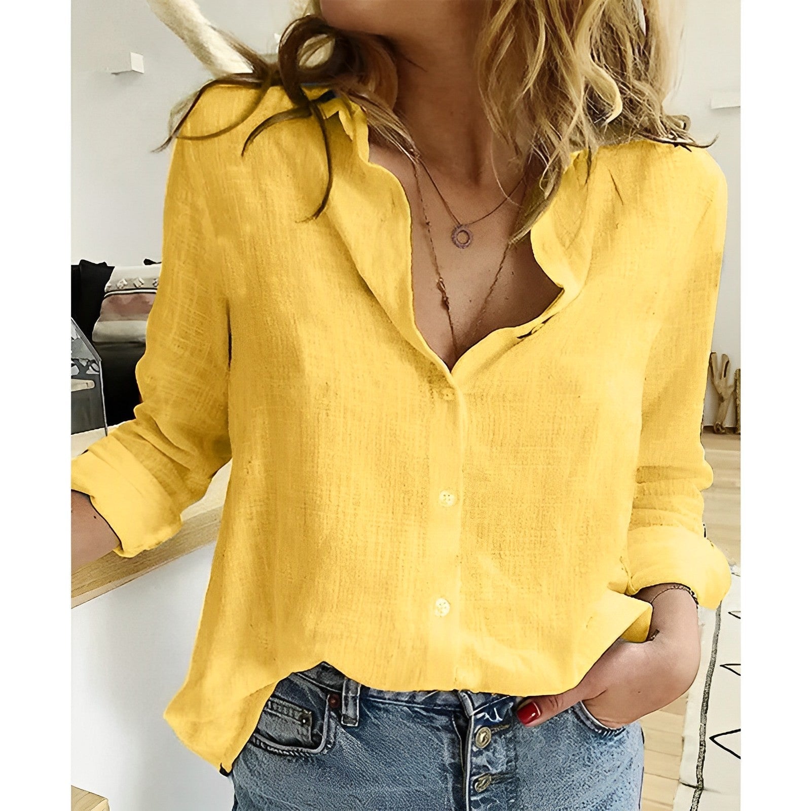 Yellow long-sleeve button-down blouse with V-neck and button front