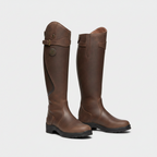 Pair of knee-high waterproof brown boots with side buckle strap and chunky grip sole