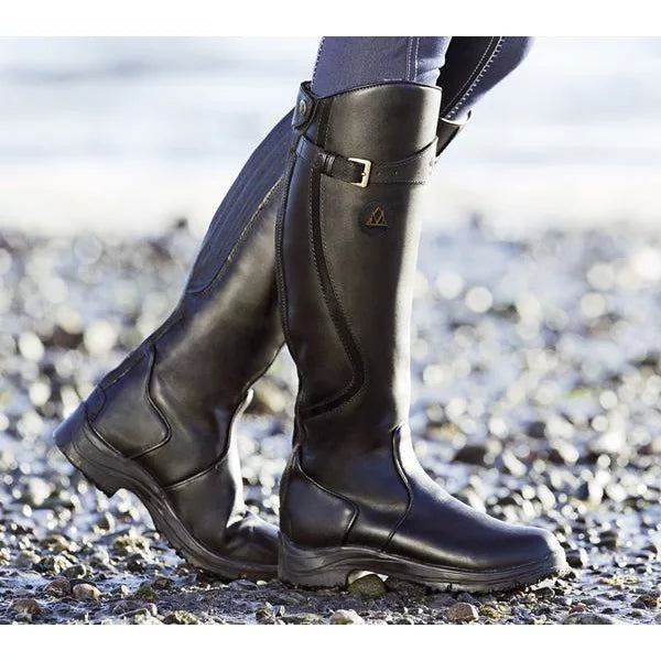 Knee-high black waterproof boots with buckle strap and rugged tread grip sole