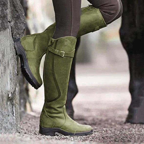 Knee-high waterproof green boots with buckle strap and textured grip tread sole