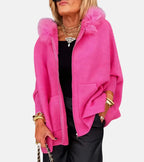 Hot pink hooded coat with zip front, front pockets, and plush fur collar detail