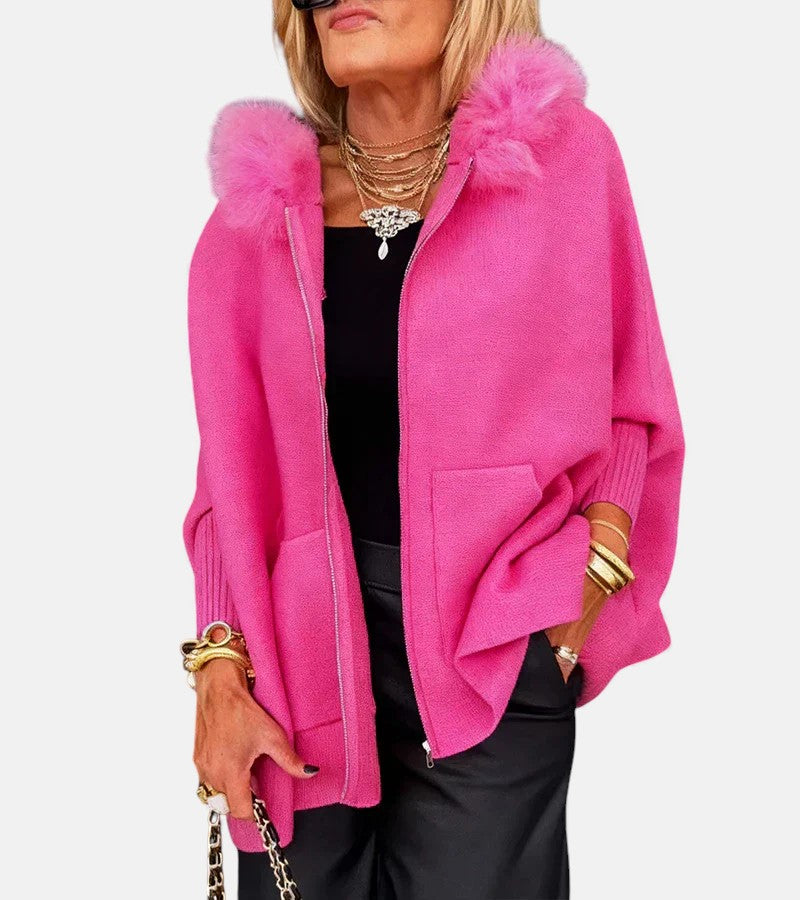 Hot pink hooded coat with zip front, front pockets, and plush fur collar detail