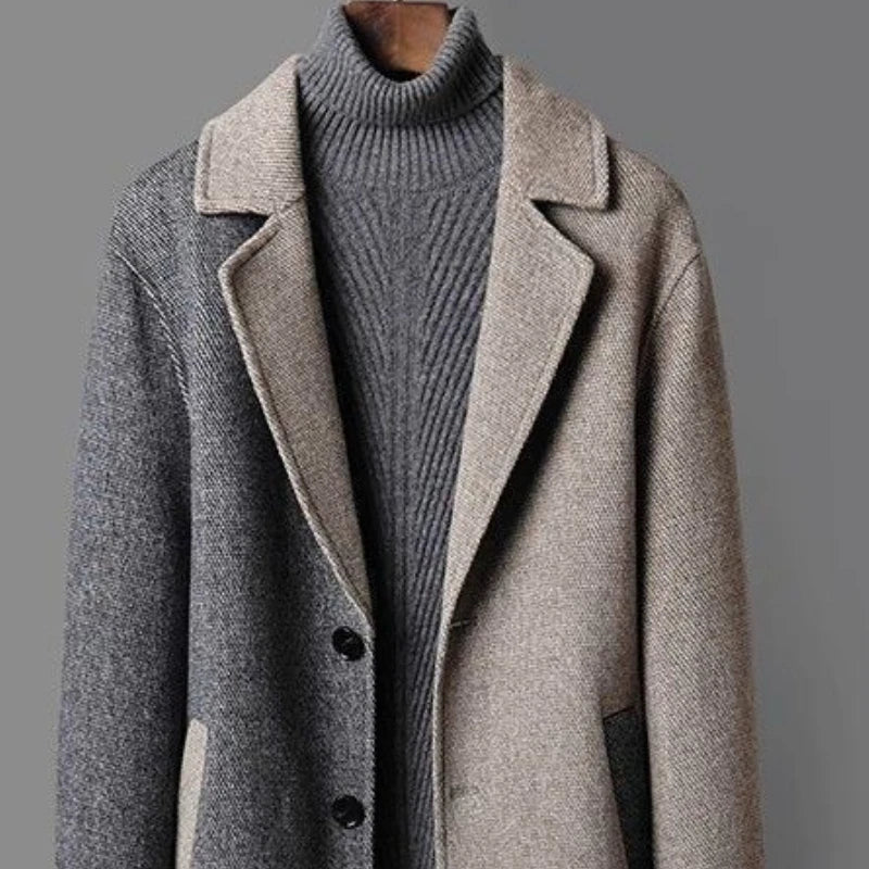 Dual-tone wool coat close-up with contrast lapels and ribbed turtleneck collar