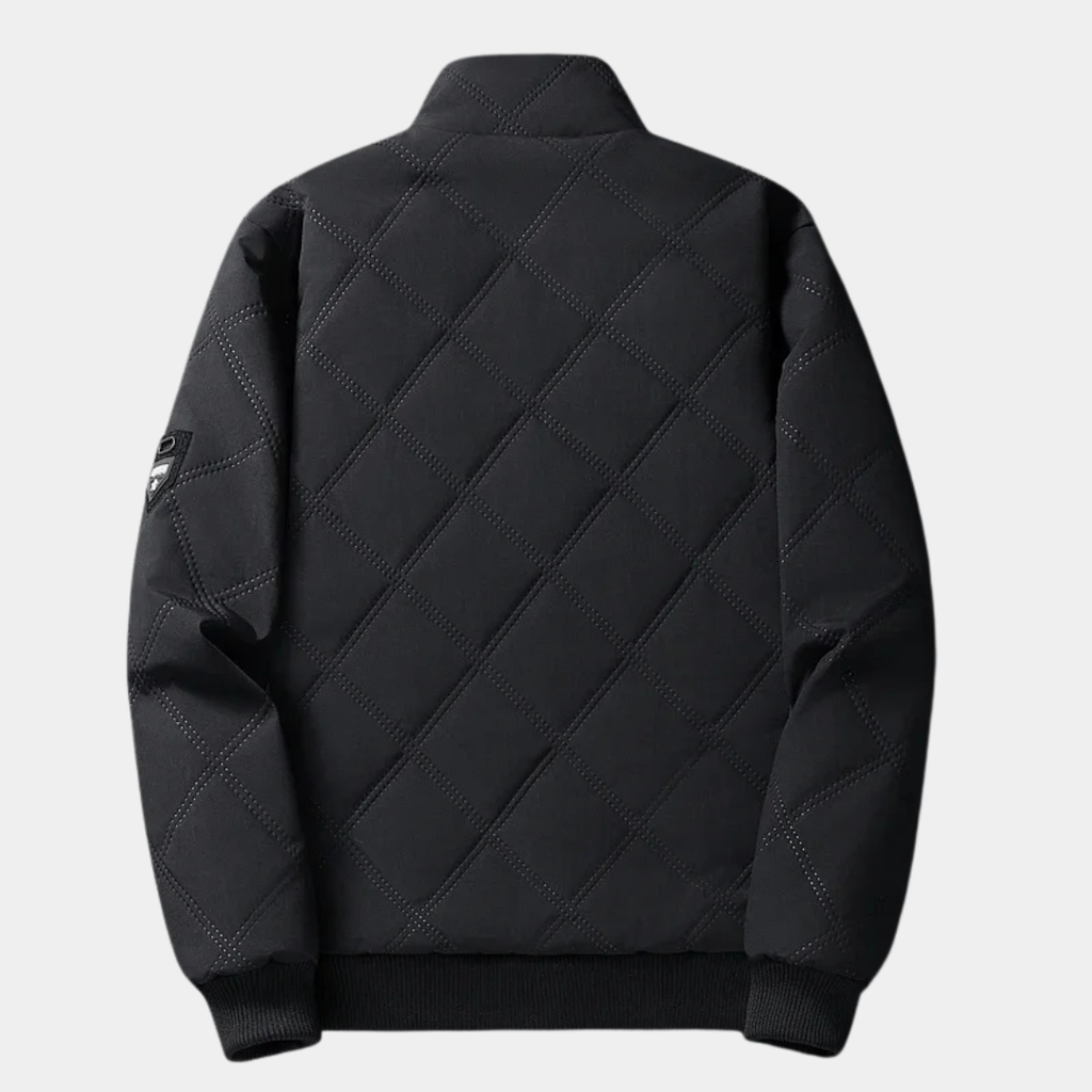 Black quilted jacket back view with stand collar and ribbed hem, zipper
