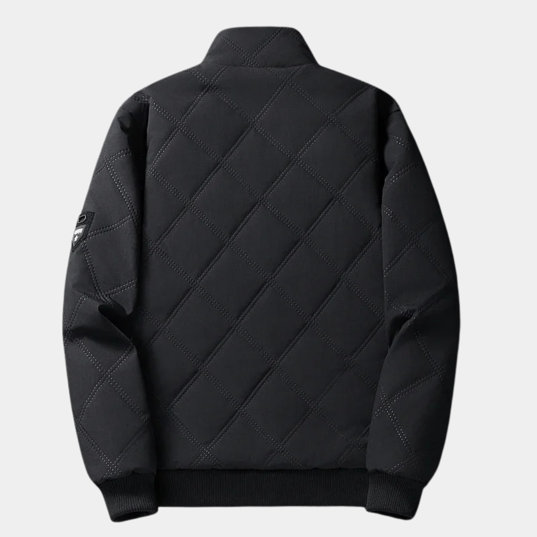 Black quilted jacket back view with stand collar and ribbed hem, zipper