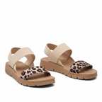 Beige flat sandals with cross strap, leopard print toe band and open toes
