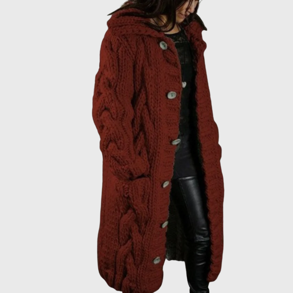 Rust-red cable-knit long coat with button front and chunky cable texture