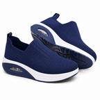 Women's navy slip-on walking trainers with white sole and air-cushion heel