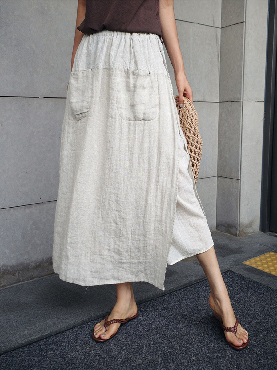 Cream linen culottes with wide legs, elastic waist, and side pockets