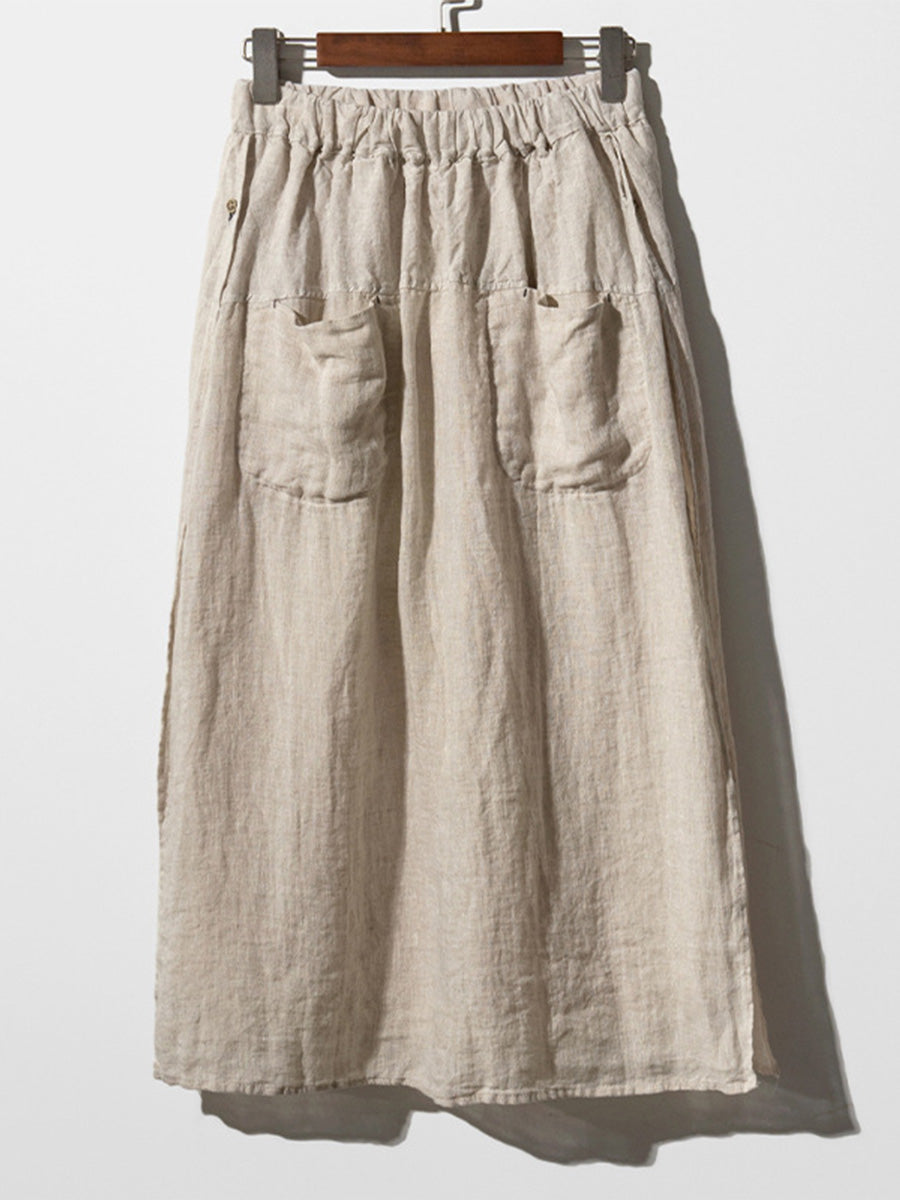 Cream linen culottes with elastic waistband and side pockets, wide-leg drape