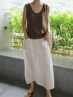 Cream linen culottes with wide legs and side pockets, gathered elastic waist