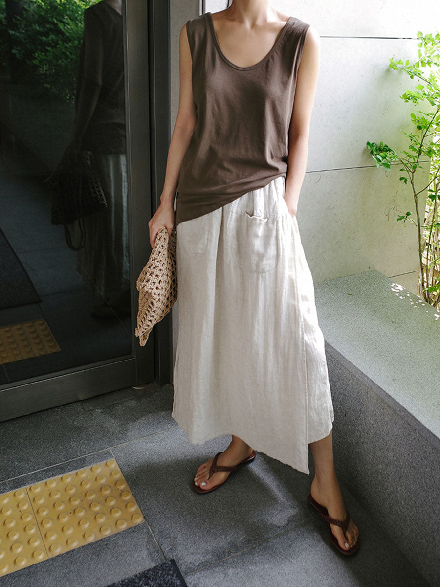 Cream linen culottes with wide legs and side pockets, elastic waist and linen texture