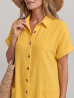 Yellow short-sleeve button-front dress with point collar and chest pocket