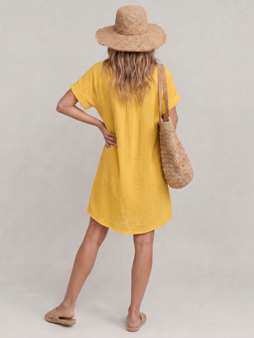 Yellow knee-length button-front dress with short sleeves, back view