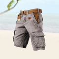Gray cargo shorts with tan webbed belt, side cargo pockets, relaxed fit