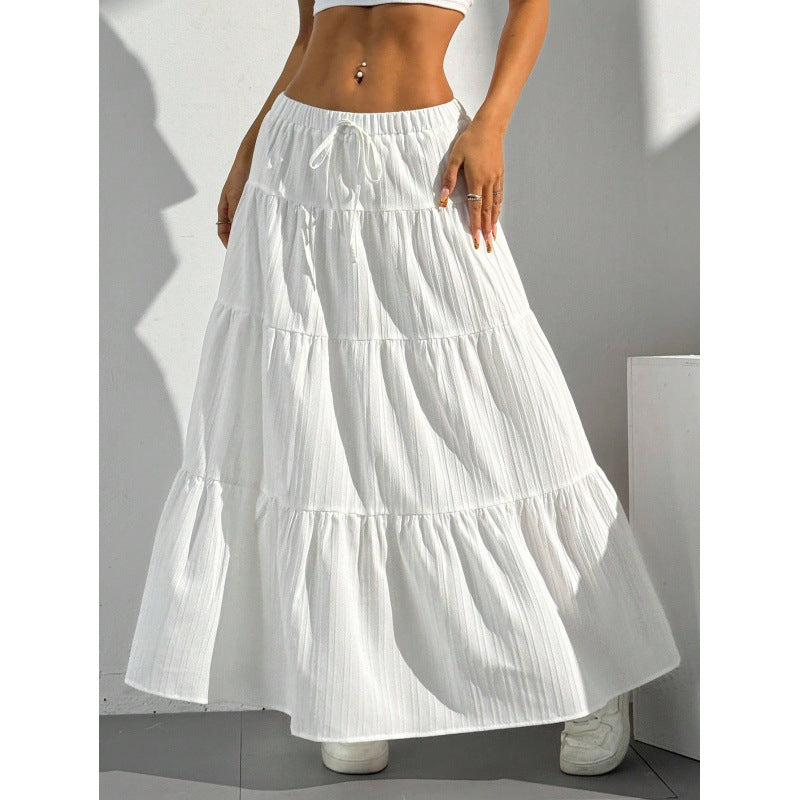 White long tiered A-line skirt with elastic drawstring waist and layered ruffle tiers