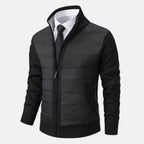 Black quilted puffer jacket with zip front, knit sleeves, and ribbed hem