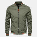 Men's green windproof jacket with front zipper and ribbed collar/cuffs.