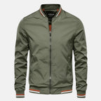 Men's green windproof jacket with front zipper and ribbed collar/cuffs.