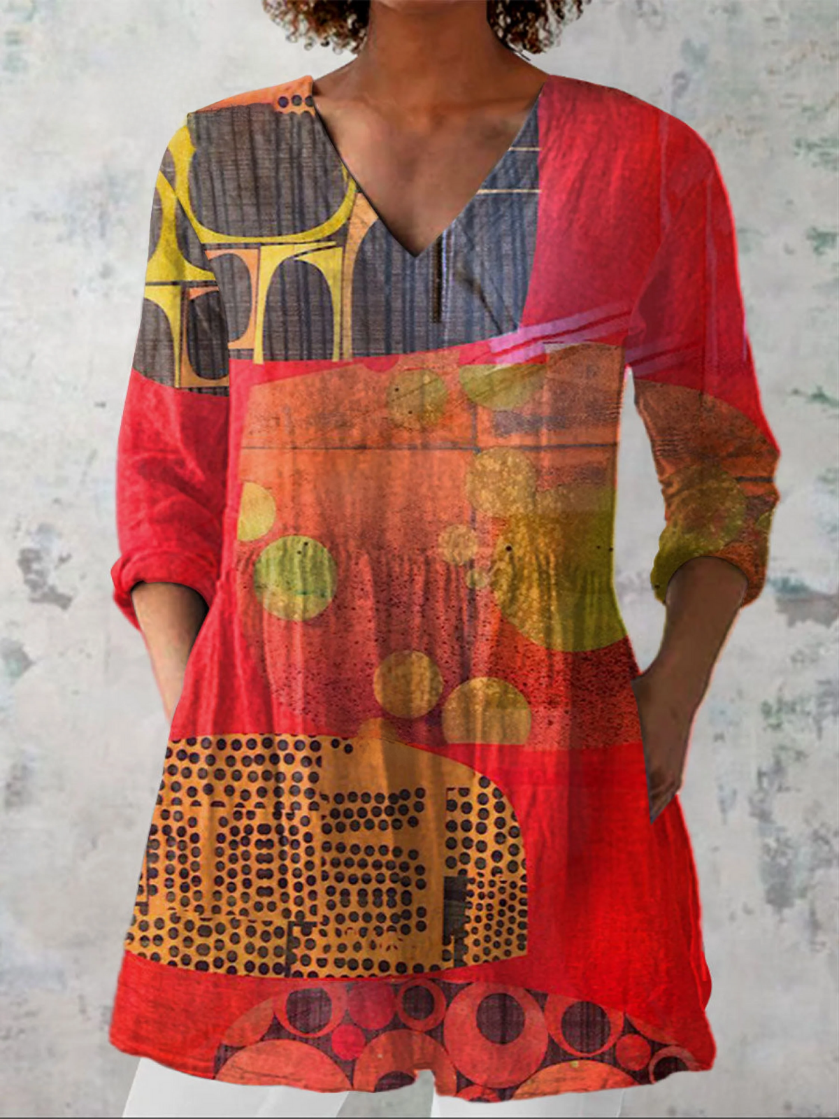 Red abstract-pattern V-neck blouse with 3/4 sleeves and loose relaxed fit