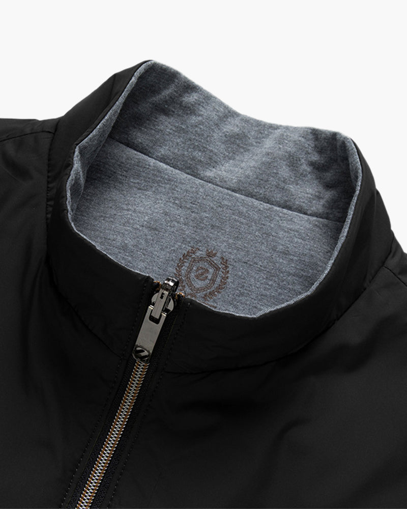 Insulated bodywarmer vest with gray inner lining, front zip and hood-style stand collar