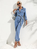 Light blue denim button-front two-piece with chest pockets, tied waist, relaxed jogger fit