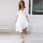 White bohemian midi dress with deep V-neck and lace-edged tiers, mid sleeves