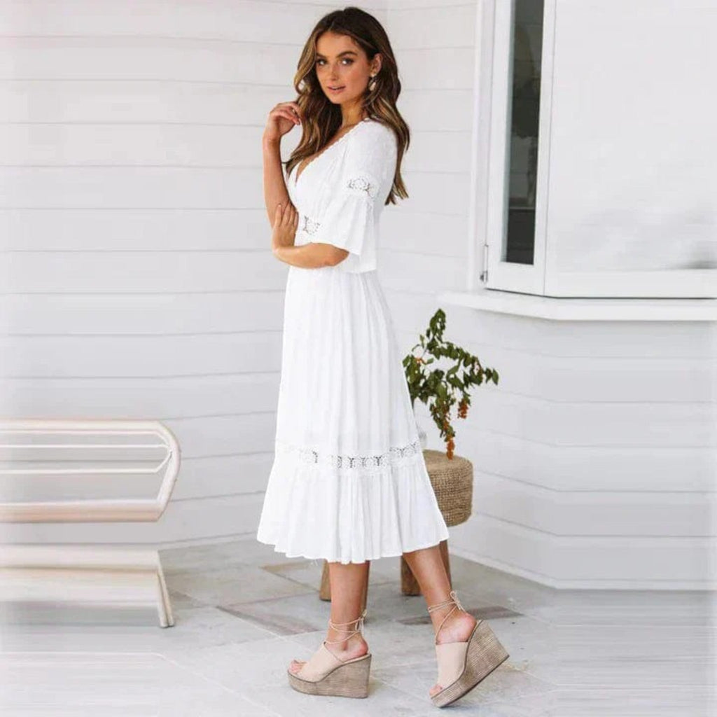 White bohemian midi dress with lace V-neck and tiered skirt, short sleeves