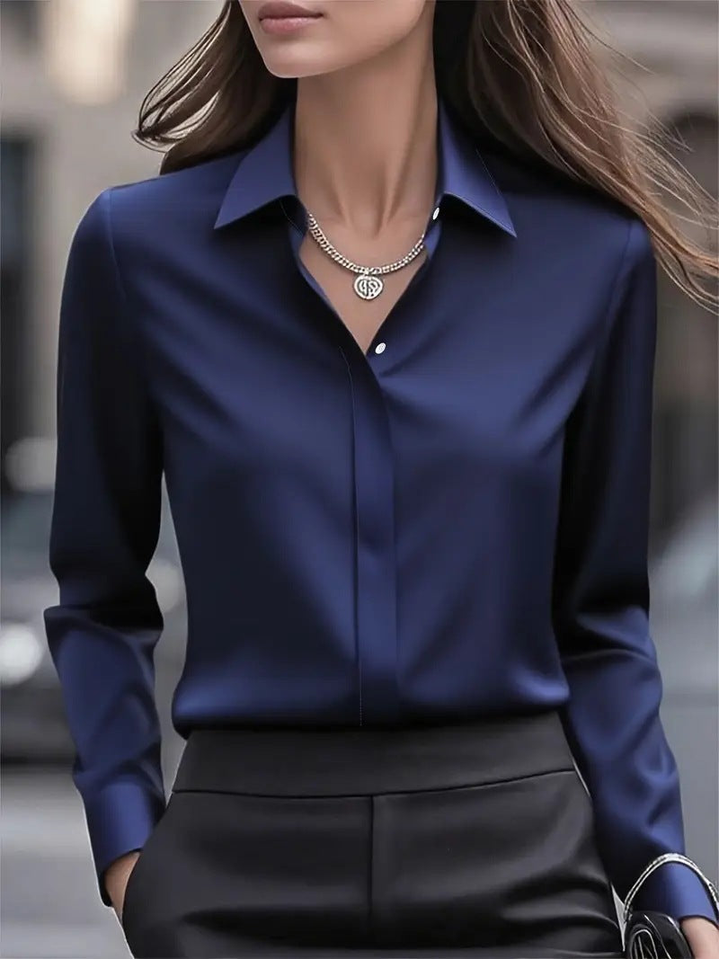 Dark blue button-up blouse with pointed collar and long sleeves