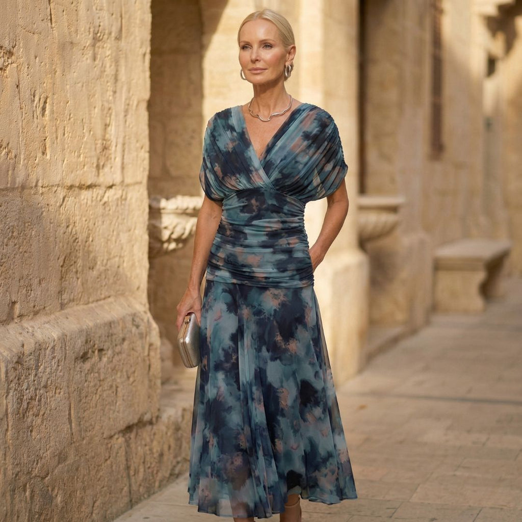 Off-shoulder pleated maxi dress with draped V neckline, blue watercolor print