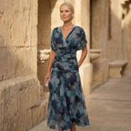 Off-shoulder pleated maxi dress with draped V neckline, blue watercolor print