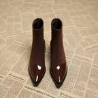 Brown suede ankle boots pair with glossy pointed toe and block heel