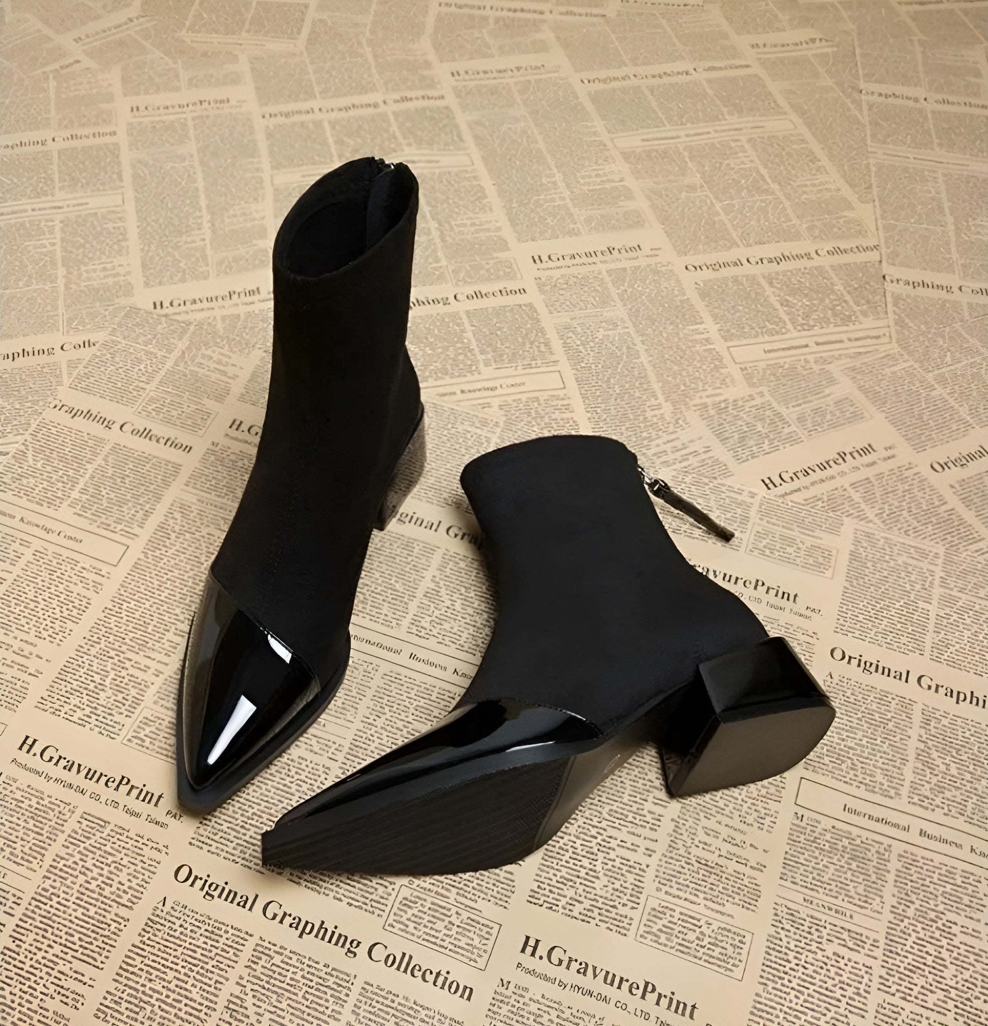 Black suede ankle boots pair with glossy pointed toe and chunky block heel