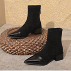 Black suede ankle boots with glossy pointed toe and woven platform midsole