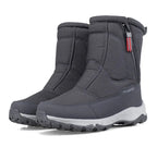 Mid-calf snow boots in dark gray with side zipper, molded toe guard, and lug sole