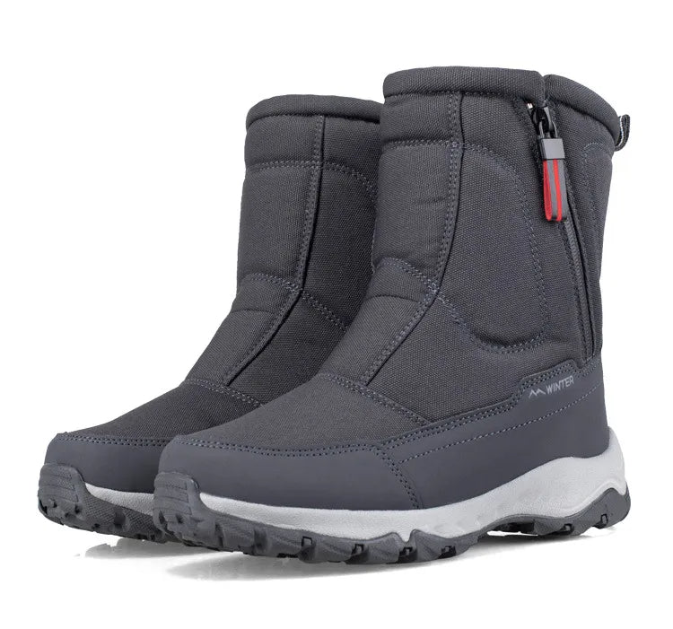 Mid-calf snow boots in dark gray with side zipper, molded toe guard, and lug sole
