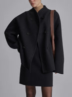 Black women's double-breasted pea coat with dark buttons and tailored cropped silhouette