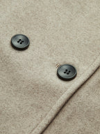 Taupe pea coat fabric with dark double-breasted buttons, round button details visible