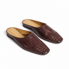 Pair of brown leather slip-on mules with woven square toe design and low heel