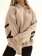 Women’s khaki hooded jacket with black sleeve graphic and ribbed cuffs