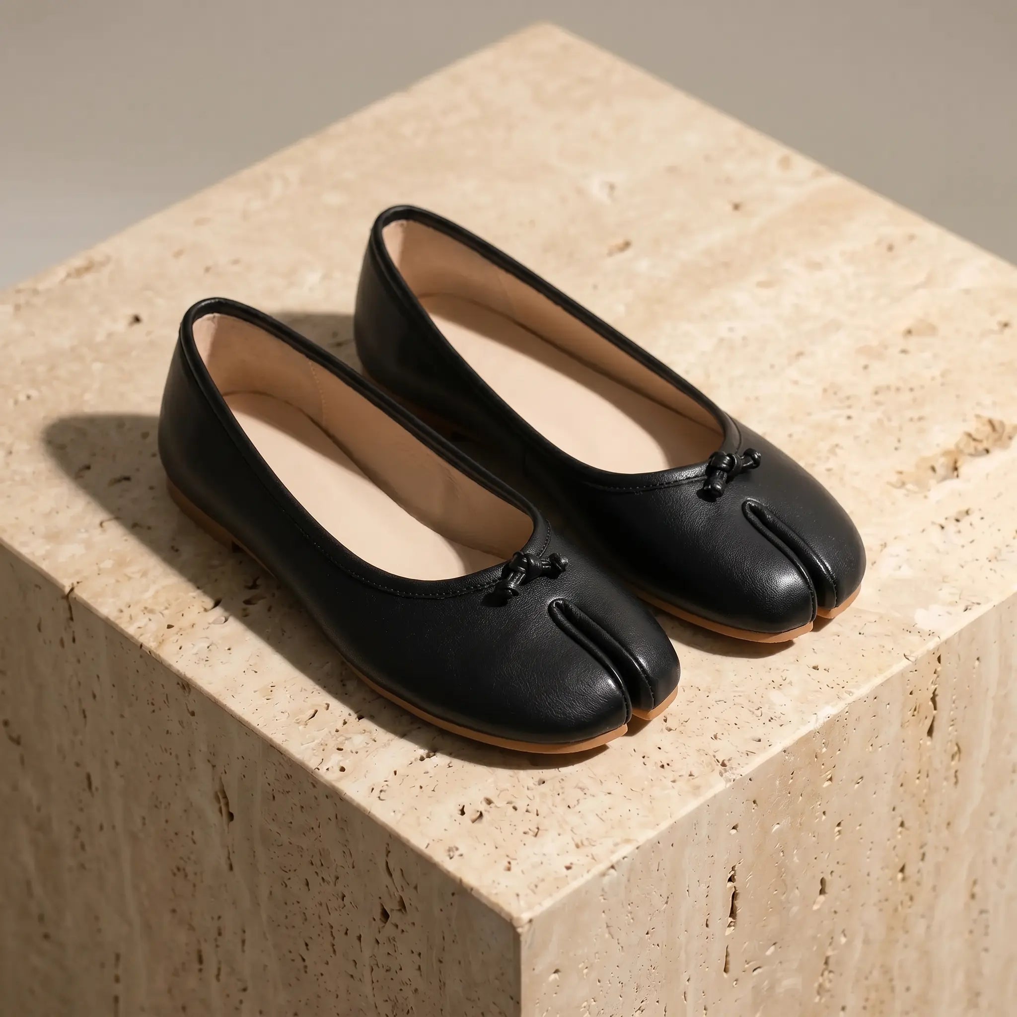 Women's split-toe ballet flats in midnight black with micro-bow detail, flat slip-on