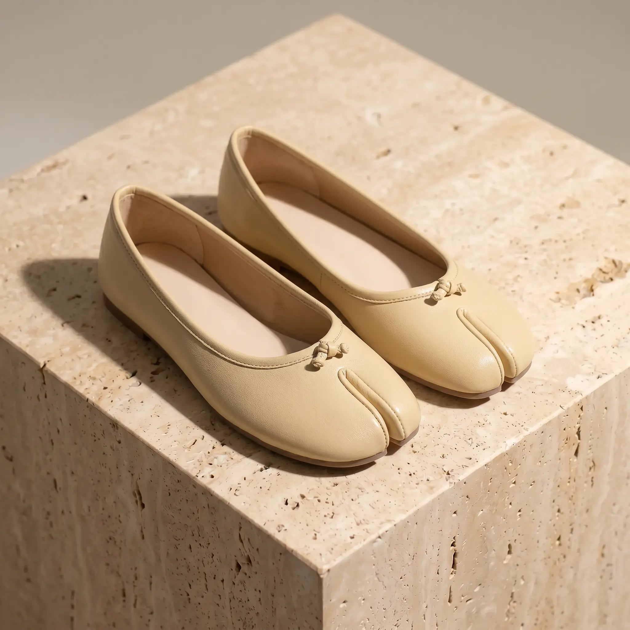 Women's split-toe ballet flats in soft apricot with micro-bow detail, flat slip-on
