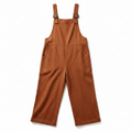 Terracotta red wide-leg overalls with adjustable buckle straps and front bib pocket