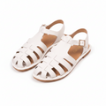 White leather gladiator sandals with ankle strap and buckle, open toe design