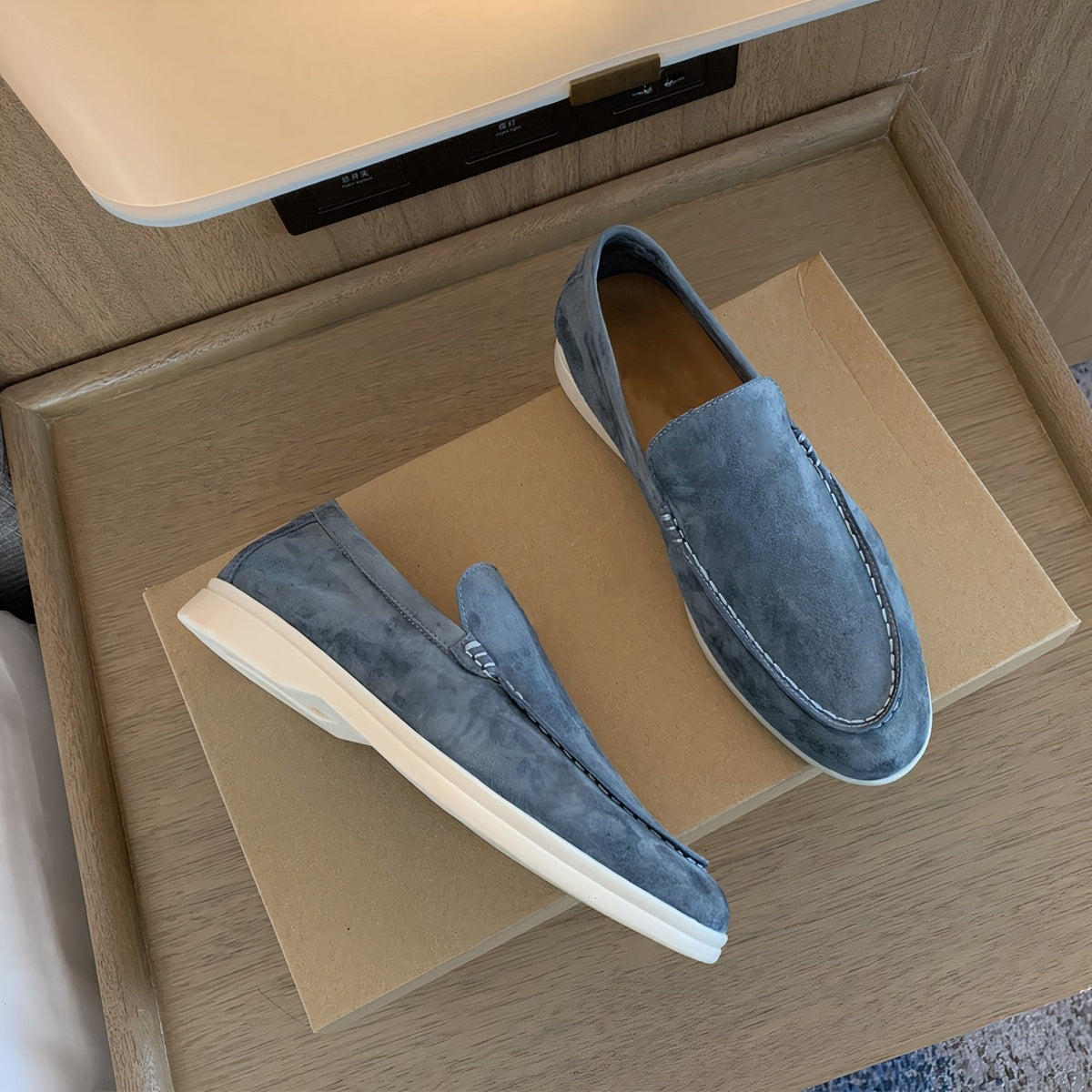 Women’s suede leather loafers, light blue slip-on with stitched moc toe.